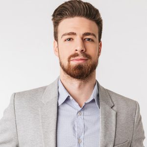 portrait-of-a-confident-young-man-dressed-in-shirt-P4DTYKC.jpg